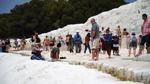 A crowd of tourists visiting the travertine pools at Pamukkale or "cotton Castle Stock Footage 89491444