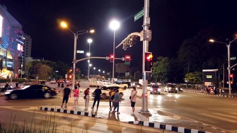 Crowd of tourists walking across Intersection and traffic congestion. Stock Footage 221668792