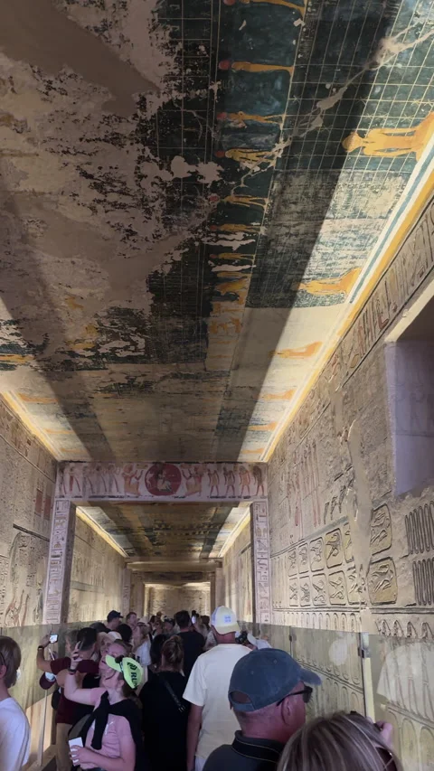Crowd of tourists walking through an ancient Egyptian tomb Stock Footage 341104507