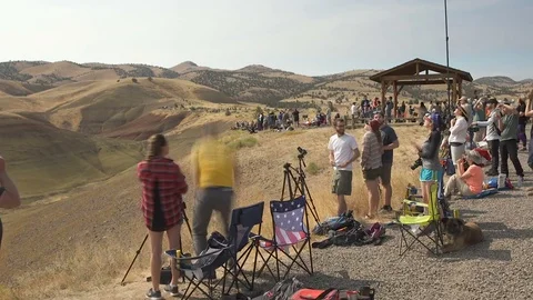 Crowd of tourists watching the eclipse Stock Footage 79474602