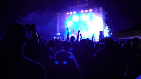 Crowd under the stage portrait, scene highlights flashes bokeh reflections Stock Footage 118140560