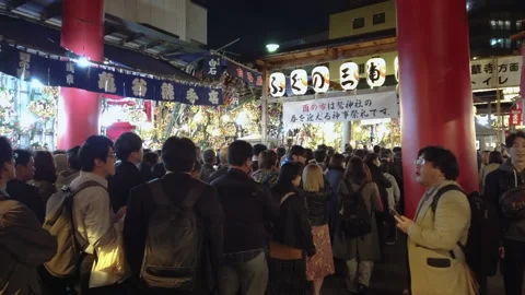 Crowd under the torii gate of Ootori shrine during Tori-no-Ichi Fair. Stock Footage 143616679