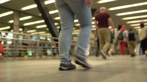 Crowd of unrecognizable pedestrians walks through the underpass. Low angle view Stock Footage 281412341