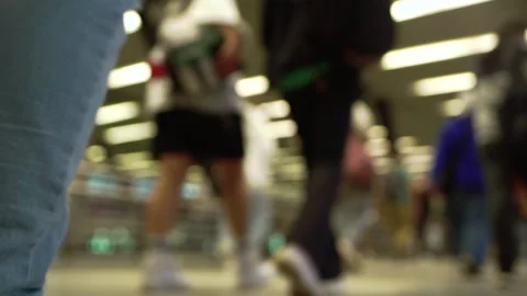 Crowd of unrecognizable pedestrians walks through the underpass. Low angle view Stock Footage 281412407