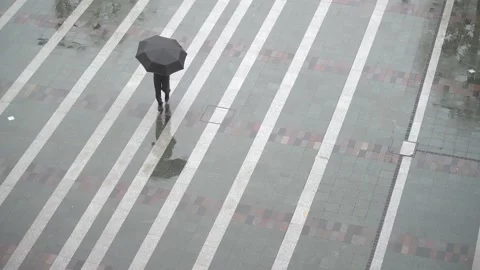 Crowd of unrecognizable people walking in the station square wearing colorful um Stock Footage 155610028
