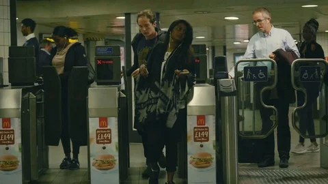 Crowd using the exit gates at a central London underground tube station Stock Footage 88951254