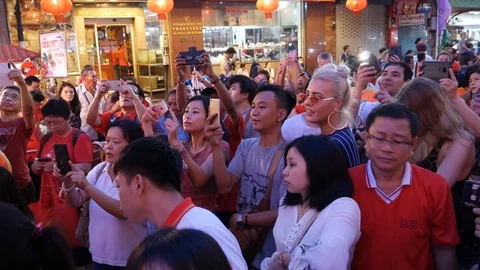 Crowd using smart phones during cultural celebration Stock Footage 105954297