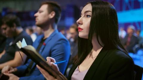 Crowd viewer seminar writed copybook. Audience group business woman write paper. Stock Photos