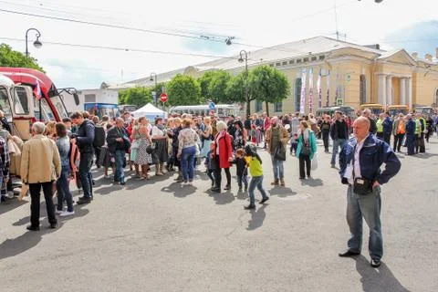 Crowd of visitors between the buses. Stock Photos