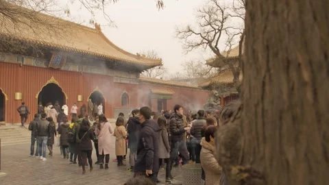 Crowd of Visitors Outside Lama Temple with Incense Smoke in Beijing, China Stock Footage 345684532