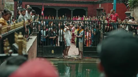 Crowd Waiting for Priests during Gai Jatra in Harisiddhi, Nepal Stock Footage 318717162