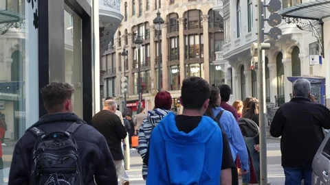 Crowd walking along busy sidewalk in Madrid Stock Footage 334331453