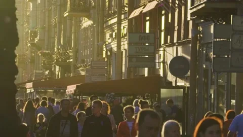 A crowd walking along Nevsky Prospect with old buildings on a warm Sunday Stock-Footage 146979423