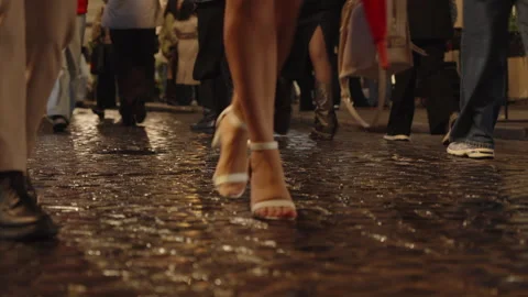 Crowd Walking Along Rainy Cobblestone Streets in the Old Town Stock Footage 345528483