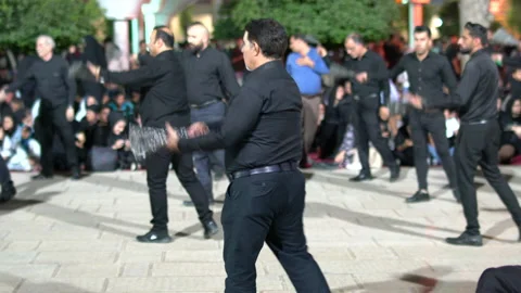 Crowd walking and beating themselves during Muharram, Iran, 4K, DNxHR Stock Footage 150170075