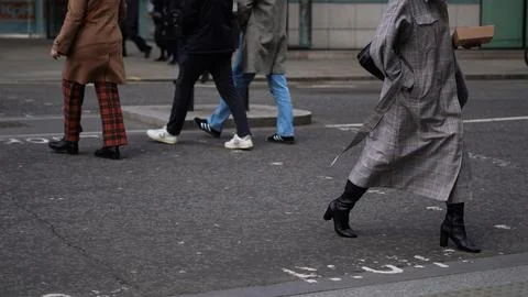 Crowd walking anonymously in an urban setting Stock Photos