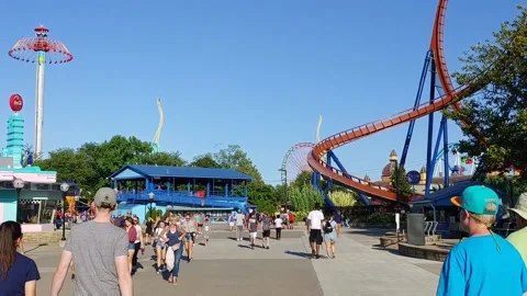 Crowd walking around the Cider Point roller coaster park Stock Footage 212279061