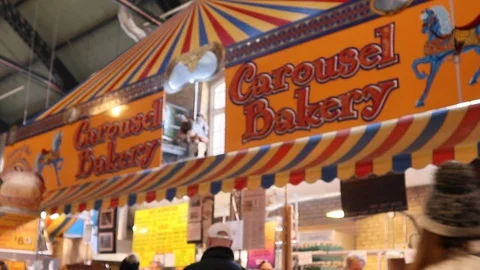 Crowd walking bye the Carousel Bakery in St. Lawrence Market Toronto 動画素材 125648074