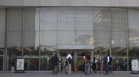 Crowd walking into courthouse Stock Footage 64954277