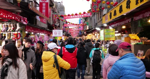 Crowd walking down Dihua Street market in Taipei, diminishing perspective Stock Footage 341005339