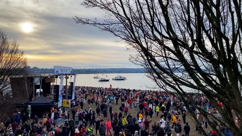 Crowd Walking By Empty Stage Entertainment At English Bay Beach Polar Bear Swim Stock Footage 260275278