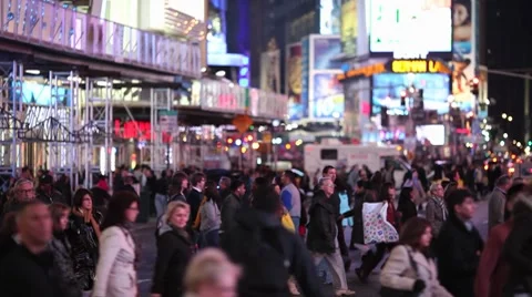 Crowd Walking Intersection crossing street at night new york times square Stock Footage