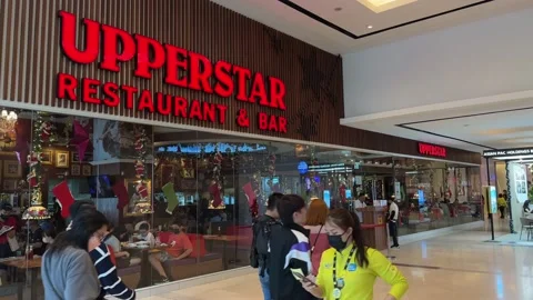 Crowd Walking Past Upperstar Restaurant and Bar at Imago Shopping Mall Stock Footage 228441246