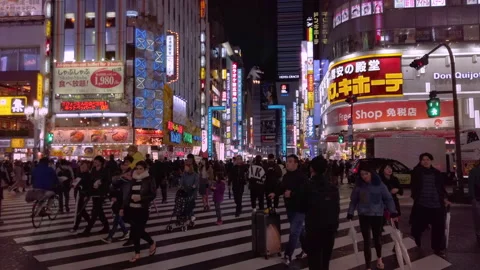 Crowd walking at pedestrian crossing of Central Road of Kabukicho in Shinjuku Stock Footage 148440574