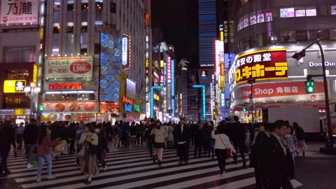 Crowd walking at pedestrian crossing of Central Road of Kabukicho in Shinjuku Stock-Footage 148440738