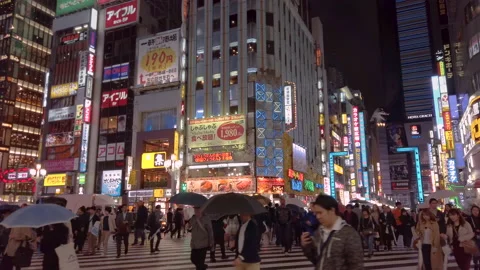 Crowd walking at pedestrian crossing of Central Road of Kabukicho in Shinjuku Stock-Footage 148442449