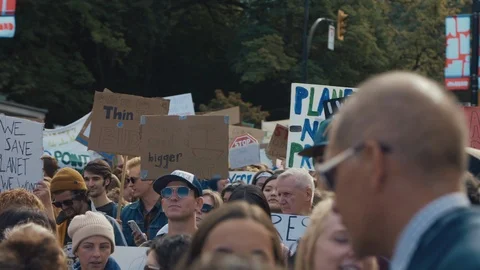 Crowd walking with protest signs for climate action. Vancouver, Sept 2019. Stock Footage 117964019