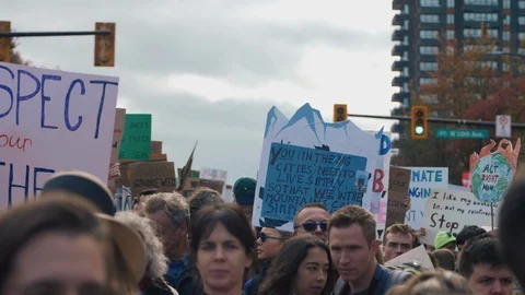 Crowd walking with protest signs for climate action. Vancouver, Sept 2019. Video stock 117964450