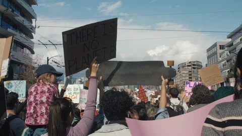Crowd walking with protest signs for climate action. Vancouver, Sept 2019. Video stock 117965579