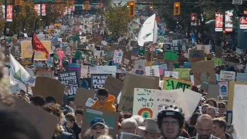 Crowd walking with protest signs for climate action. Vancouver, Sept 2019. Stock Footage 117965974