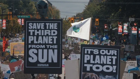 Crowd walking with protest signs for climate action. Vancouver, Sept 2019. Video stock 117966527