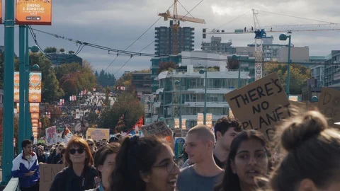 Crowd walking with protest signs for climate action. Vancouver, Sept 2019. Video stock 117967864