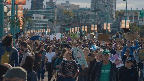 Crowd walking with protest signs for climate action. Vancouver, Sept 2019. Video stock 117969637