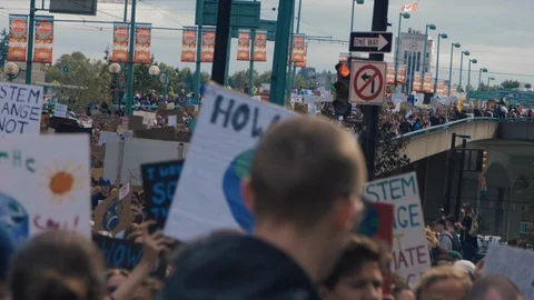 Crowd walking with protest signs for climate action. Vancouver, Sept 2019. Video stock 117971496