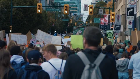 Crowd walking with protest signs for climate action. Vancouver, Sept 2019. Video stock 117971914