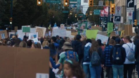 Crowd walking with protest signs for climate action. Vancouver, Sept 2019. Video stock 117972397