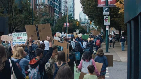 Crowd walking with protest signs for climate action. Vancouver, Sept 2019. Video stock 117973035