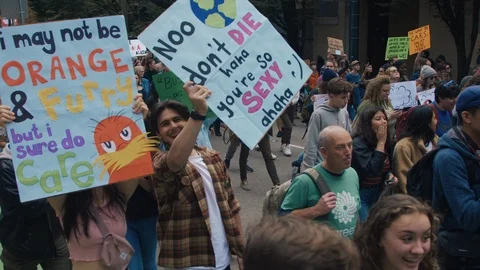 Crowd walking with protest signs for climate action. Vancouver, Sept 2019. Video stock 117973496