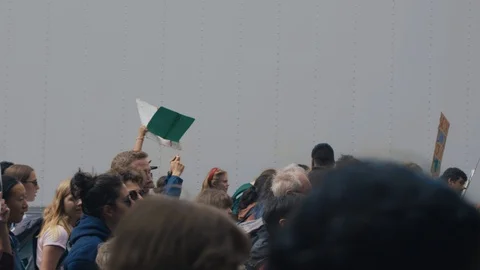 Crowd walking with protest signs for climate action. Vancouver, Sept 2019. Stock Footage 117975944