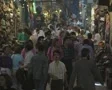 Crowd walking through indoor shopping market SD Footage