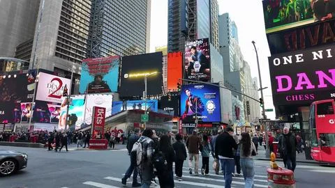 Crowd Walking Through Times Square New York Stock Photos