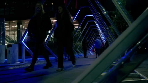 Crowd walking through a tunnel of lights Stock Footage 219831134