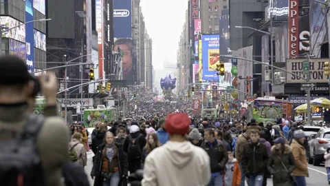 Crowd walking towards Times Square in NYC after Thanksgiving Parade in NYC Stock Footage 200776695
