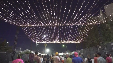 Crowd walking under dreamy lights Stock Footage 116998752