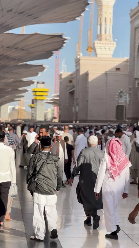 Crowd Walking Under Shade Umbrellas at Masjid Nabawi Stock-Footage 346983244