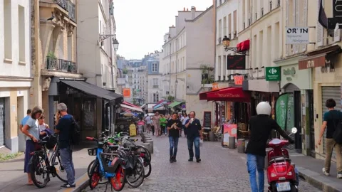 A Crowd Walks Down a Pretty Cobbled Street, Paris, 4K Stock Footage 220577245
